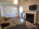 Comfortable living room with hardwood floors, plantation shutters, and cozy fireplace at 109 Oakland Ave, Chester, SC 29706