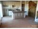 Unfinished kitchen with island, granite countertops, cabinets, and exposed drywall, ready for customization at 128 Peppervine Ln, Statesville, NC 28625