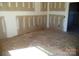 Unfinished living room with bare concrete floors, exposed drywall, and natural light at 128 Peppervine Ln, Statesville, NC 28625