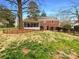 Expansive backyard with a screened-in porch, fenced area, and mature trees offering shade at 1429 Alexander Rd, Rock Hill, SC 29732