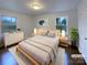 Cozy bedroom with hardwood floors, soft lighting, and bright windows at 1429 Alexander Rd, Rock Hill, SC 29732