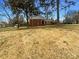 Charming brick home with a well-manicured front lawn, mature trees, and a classic architectural style at 1429 Alexander Rd, Rock Hill, SC 29732