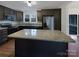 Modern kitchen featuring stainless steel appliances, granite countertops, and dark wood cabinets at 1429 Alexander Rd, Rock Hill, SC 29732