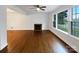 Spacious living room with hardwood floors, a fireplace, and large windows for natural light at 1429 Alexander Rd, Rock Hill, SC 29732