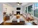 Bright living room with fireplace, hardwood floors, and large windows for ample natural light at 1429 Alexander Rd, Rock Hill, SC 29732