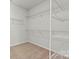 Walk-in closet with carpeted floors and white wire shelving, providing ample storage space at 162 Holsworthy Dr, Mooresville, NC 28115