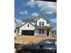 New construction home featuring a two-car garage and covered entryway awaiting finishing touches at 162 Holsworthy Dr, Mooresville, NC 28115