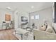 Cozy living room featuring modern furniture, a sleek television, and natural light at 162 Holsworthy Dr, Mooresville, NC 28115