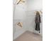 Walk-in closet featuring wire shelving, with a hanging robe and wooden hangers at 164 Holsworthy Dr, Mooresville, NC 28115