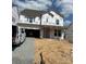 New two-story home showcasing modern design, large windows, and pre-construction wrapped facade at 164 Holsworthy Dr, Mooresville, NC 28115