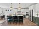 Open kitchen with stainless steel appliances, island, and green cabinets providing ample counter space at 164 Holsworthy Dr, Mooresville, NC 28115