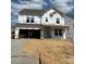 New two-story home under construction, showcasing the home's facade and future landscaping at 166 Holsworthy Dr, Mooresville, NC 28115