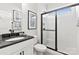 Modern bathroom featuring a glass-enclosed shower, sleek vanity, and neutral color scheme at 173 Holsworthy Dr, Mooresville, NC 28115
