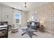 Charming Bedroom with modern wallpaper, a cozy crib, and a zebra-patterned rug at 173 Holsworthy Dr, Mooresville, NC 28115