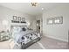 Bright bedroom with decorative wall art and sports-themed bedding, offering a cozy and inviting space at 173 Holsworthy Dr, Mooresville, NC 28115