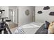 Comfortable bedroom with patterned bedding, a cat tree, and ensuite bathroom access at 173 Holsworthy Dr, Mooresville, NC 28115
