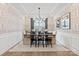 Chic dining room with patterned wallpaper, modern chandelier, and seating for six at 173 Holsworthy Dr, Mooresville, NC 28115