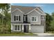 Charming two-story home with stone accents, covered porch, and attached garage at 173 Holsworthy Dr, Mooresville, NC 28115