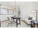 Well-lit office featuring a desk, chair, decor, and French doors leading to the hallway at 173 Holsworthy Dr, Mooresville, NC 28115