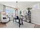 Cozy office space with large windows, a modern light fixture, and ample shelving at 173 Holsworthy Dr, Mooresville, NC 28115