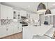 Bright, modern kitchen featuring white cabinets, an island, and stainless steel appliances at 173 Holsworthy Dr, Mooresville, NC 28115