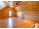 A spacious bedroom with wooden walls and a ceiling fan provides a rustic and inviting ambiance at 1847 Bertha Knight Rd, Lancaster, SC 29720