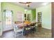 Cozy dining room with rustic wooden table, eclectic chairs, and a view to the exterior at 1847 Bertha Knight Rd, Lancaster, SC 29720