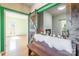 Inviting foyer showcasing a decorative bench, barn door, and view of the fireplace at 1847 Bertha Knight Rd, Lancaster, SC 29720