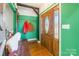 Welcoming foyer boasting a custom wood door, a coat rack, and hardwood floors at 1847 Bertha Knight Rd, Lancaster, SC 29720