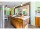 Open kitchen with an island, wooden cabinets, and view of the living room at 1847 Bertha Knight Rd, Lancaster, SC 29720