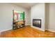Cozy living room featuring hardwood floors, decorative table, and a fireplace at 1847 Bertha Knight Rd, Lancaster, SC 29720
