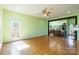 Bright, open-concept living room with hardwood floors connecting seamlessly to the kitchen and dining area at 1847 Bertha Knight Rd, Lancaster, SC 29720
