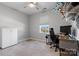 Bright bedroom with neutral tones featuring a ceiling fan, desk area and lots of light at 1875 Loggerhead Dr, Lancaster, SC 29720