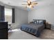 Spacious bedroom with a ceiling fan, a comfortable bed, and natural light at 1875 Loggerhead Dr, Lancaster, SC 29720