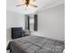 Cozy bedroom featuring a comfortable bed, a chest of drawers, and a window with curtains at 1875 Loggerhead Dr, Lancaster, SC 29720