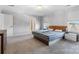 Bright primary bedroom featuring a comfortable bed, side tables, and plenty of natural light at 1875 Loggerhead Dr, Lancaster, SC 29720