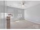 Cozy bedroom with soft carpet, natural light from two windows, and neutral walls at 1875 Loggerhead Dr, Lancaster, SC 29720