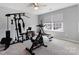 Bright exercise room features carpet floors, natural light, and essential home fitness equipment at 1875 Loggerhead Dr, Lancaster, SC 29720