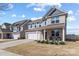 Lovely home with a well-manicured front yard and cozy front porch seating at 1875 Loggerhead Dr, Lancaster, SC 29720