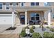 Charming front porch with outdoor seating, manicured landscaping, and a welcoming entrance at 1875 Loggerhead Dr, Lancaster, SC 29720