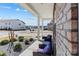 Inviting covered front porch featuring cozy seating and attractive landscaping at 1875 Loggerhead Dr, Lancaster, SC 29720