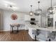 Bright eat-in kitchen features white cabinets, stainless appliances, and a quartz countertop island at 1875 Loggerhead Dr, Lancaster, SC 29720