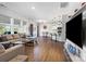 Inviting living room area features a comfortable couch, modern lighting, and durable wood-look floors at 1875 Loggerhead Dr, Lancaster, SC 29720
