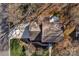 Aerial view showcasing the property's roof, driveway, and surrounding landscape at 2301 Lynbridge Dr, Charlotte, NC 28270