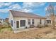 Backyard with sunroom, patio, bench and lawn at 242 Tradition Way, Rock Hill, SC 29732