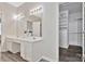 This bathroom features double sinks, vanity space, wood plank floors and a walk-in closet at 242 Tradition Way, Rock Hill, SC 29732