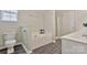 This bathroom features a tub, shower, toilet, single sink and gray plank flooring at 242 Tradition Way, Rock Hill, SC 29732