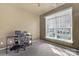 Bedroom with carpeted floors, neutral paint, and a large window for natural light at 242 Tradition Way, Rock Hill, SC 29732