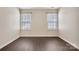 Bedroom featuring two windows and hardwood floors at 242 Tradition Way, Rock Hill, SC 29732