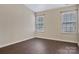 Bedroom featuring two windows and hardwood floors at 242 Tradition Way, Rock Hill, SC 29732